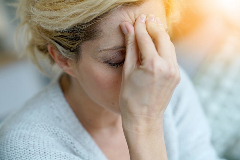 woman with migraine; treatment options for migraines