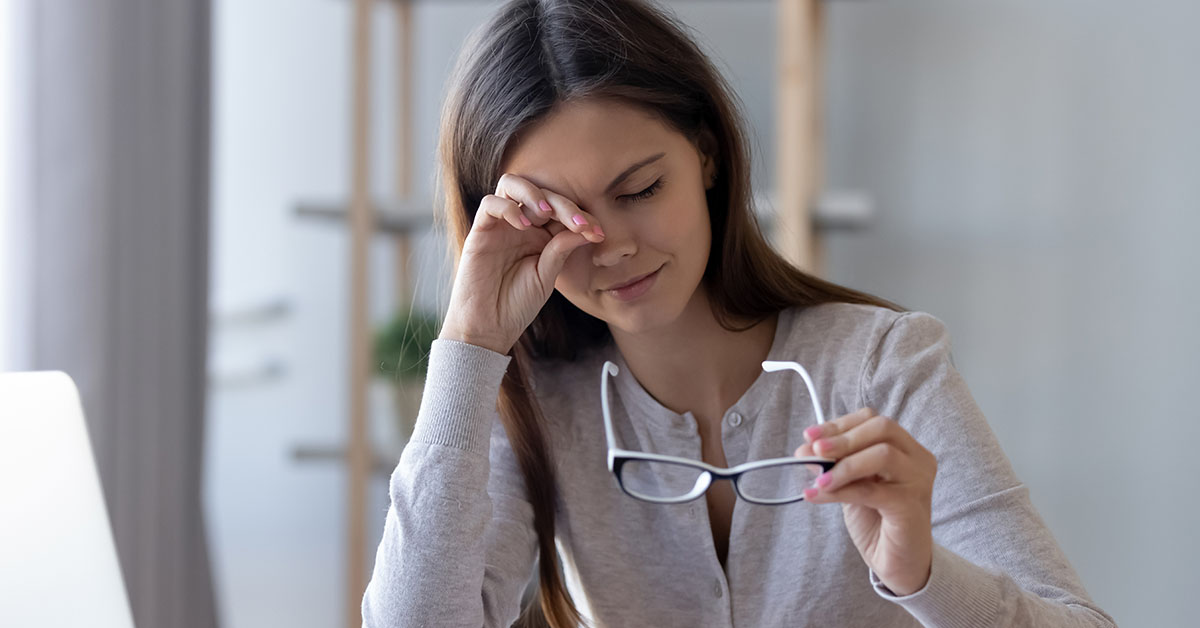 Tired student or worker rubbing irritable eyes feeling fatigue from computer work concept, overworked woman taking off glasses to relieve eye strain suffering from bad eyesight vision problem concept; blog: 10 Early Signs of Multiple Sclerosis